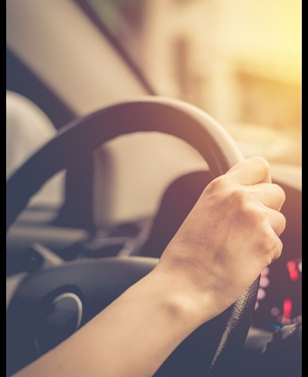 Hands on a steering wheel