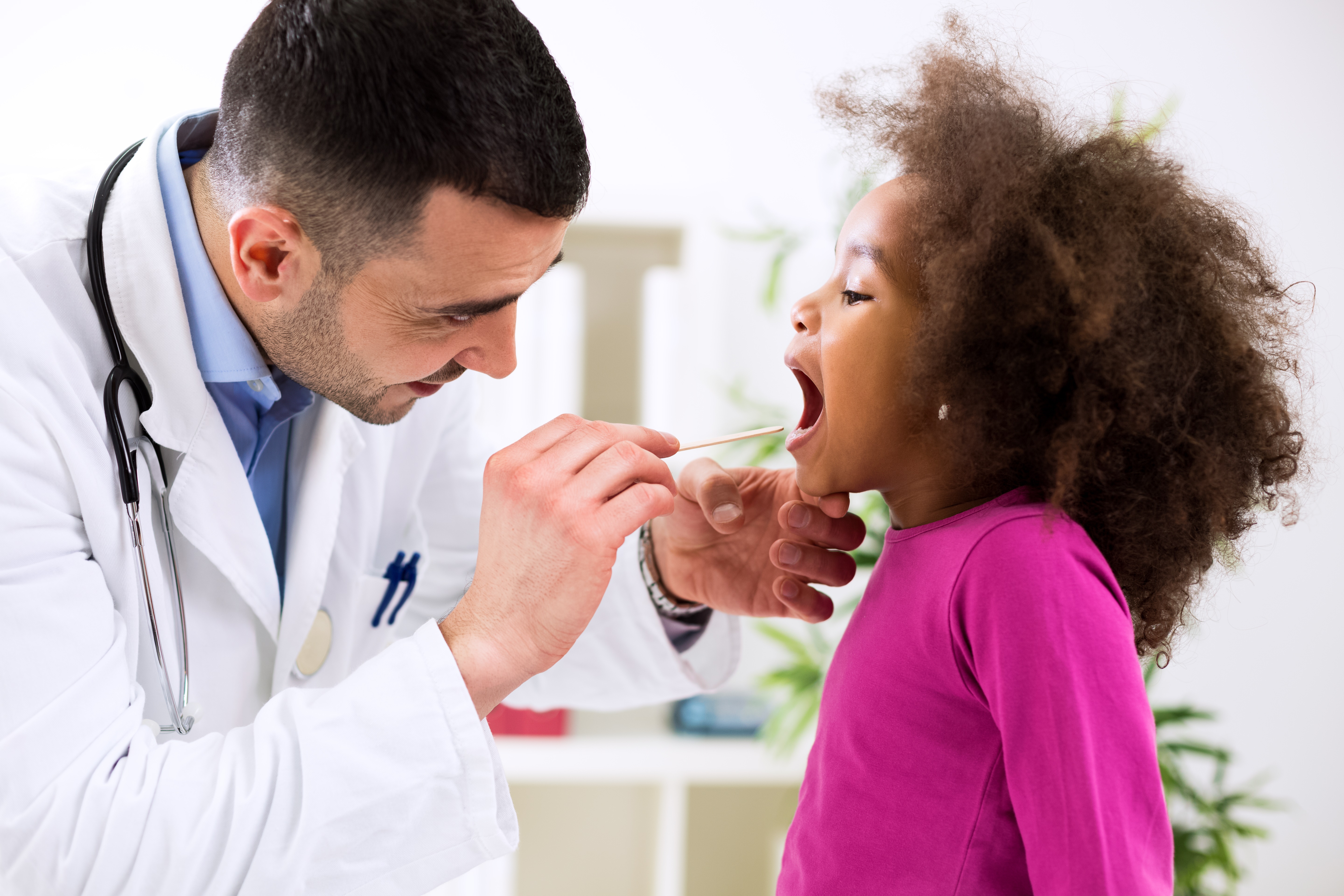 doctor checking a child