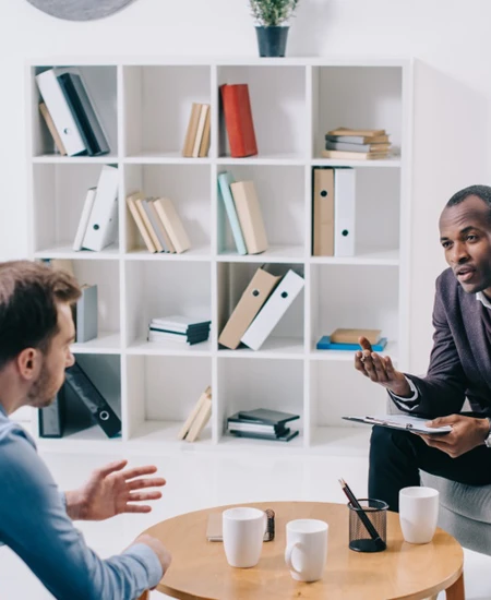 EMDR - man and counselor talking in office