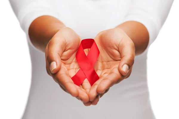 Hands holding a red ribbon