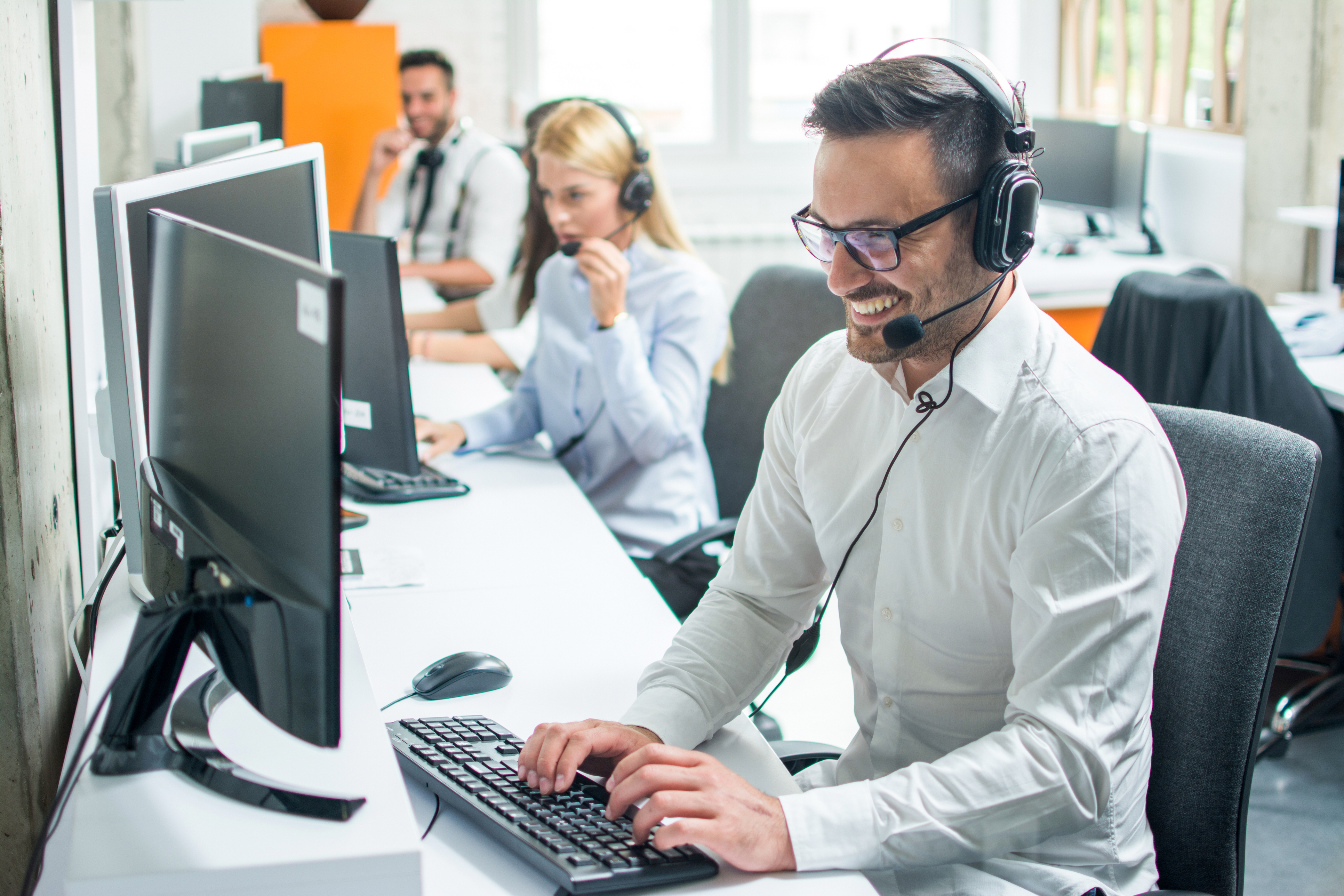 call center operator smiling with headset on