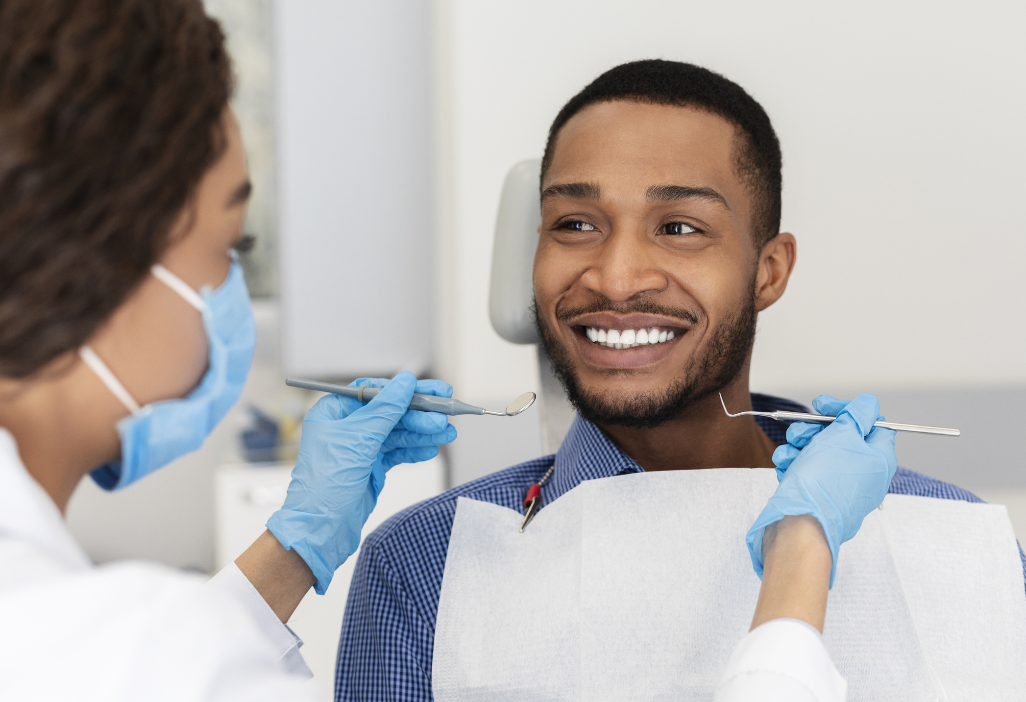 man smiling at the dentist